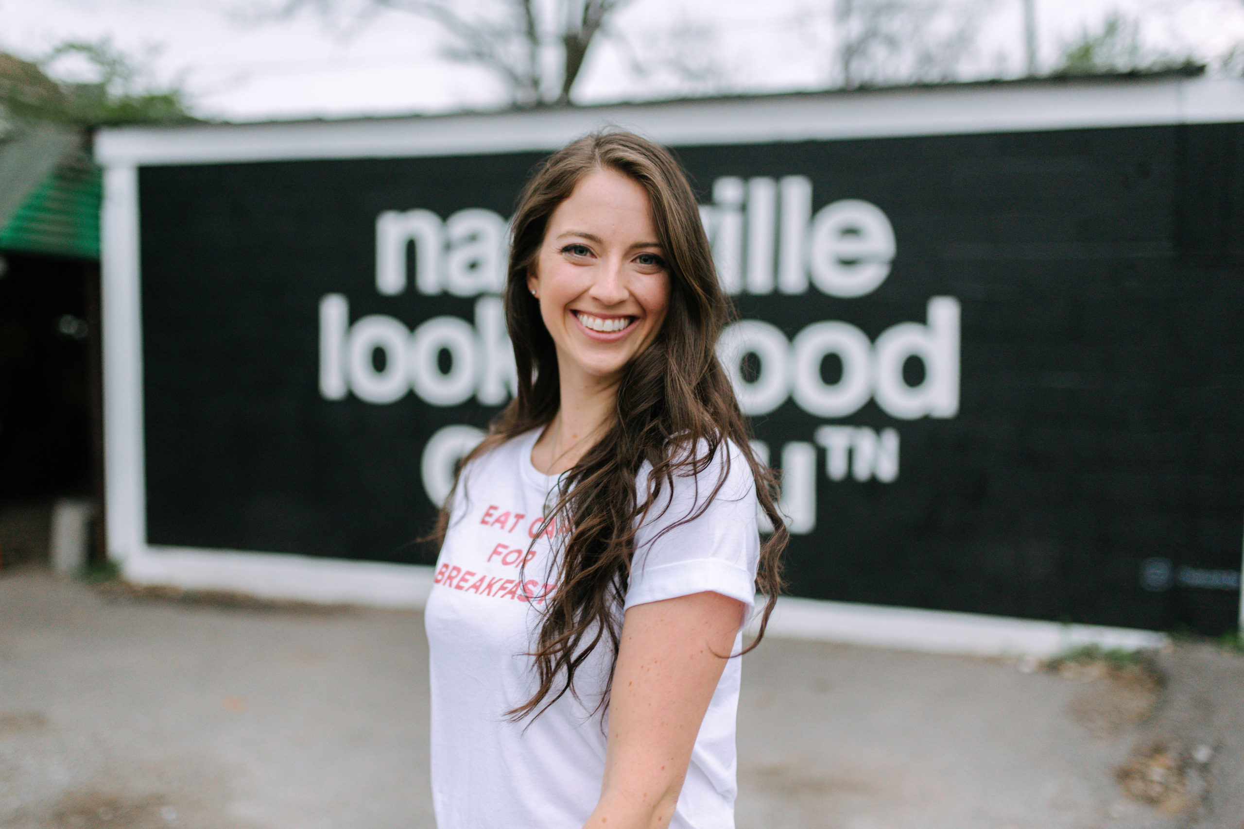 Laura Colgan smiling in a Nashville portrait photographed by Jessica Sheppard.